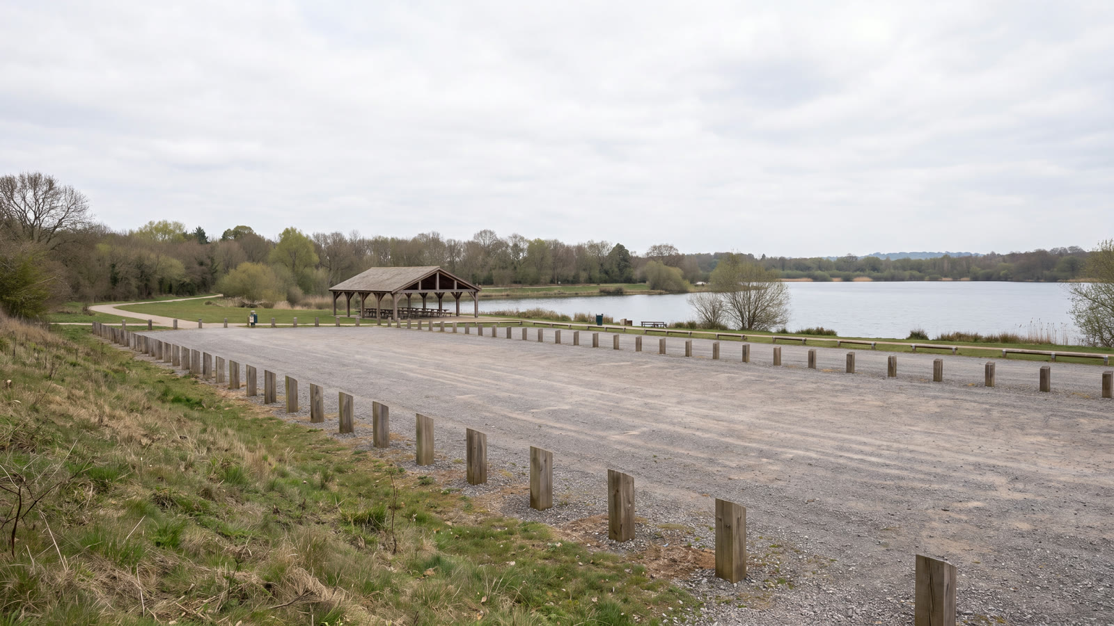 Generic lakefront event parking area with temporary cones, overflow bays and abstract review tablets