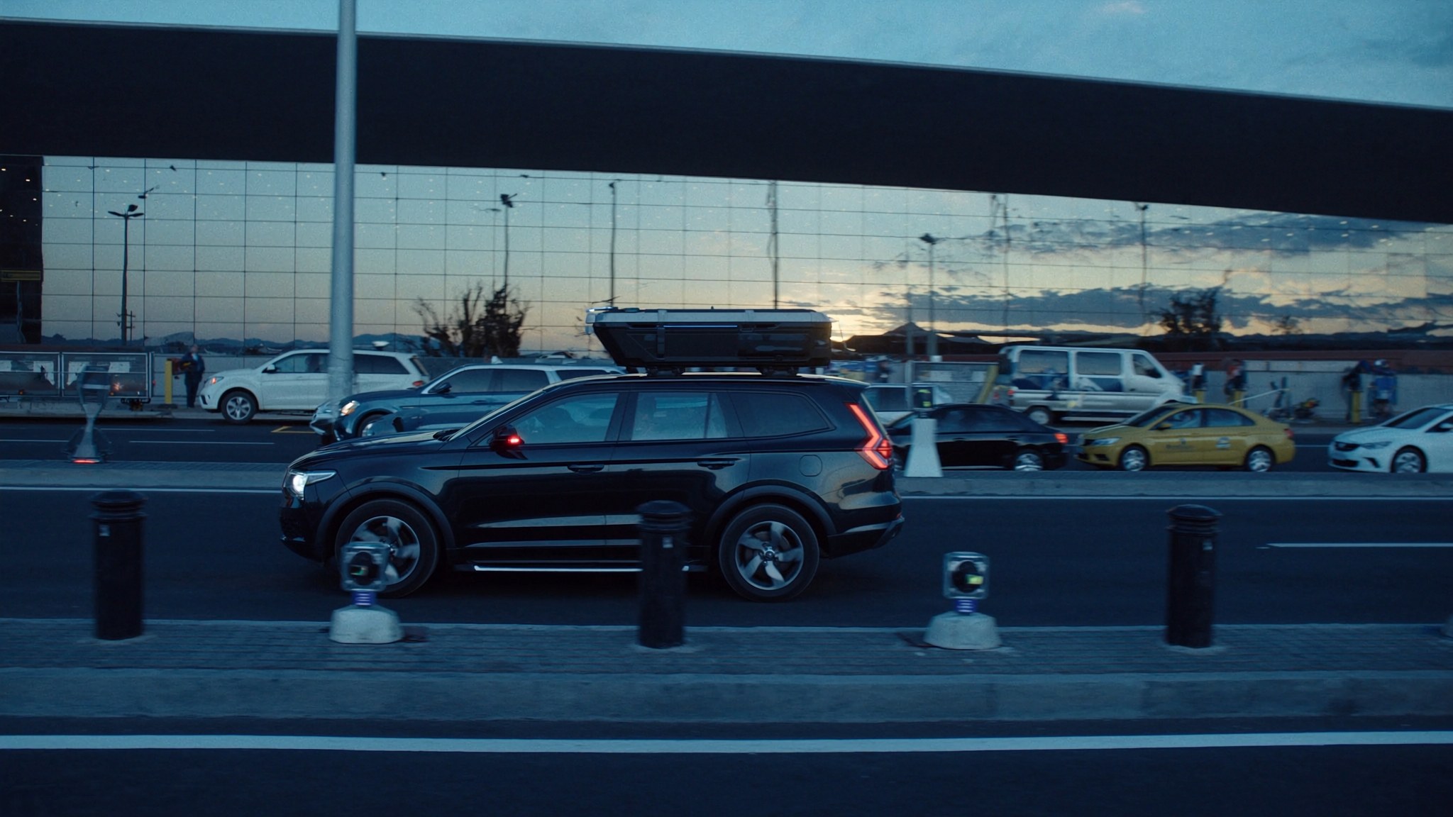 Airport landside patrol vehicle with compact ANPR equipment near terminal frontage
